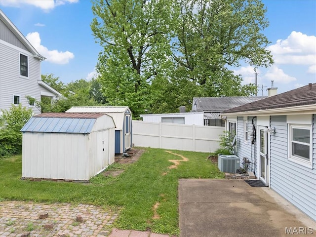 8934 Litzsinger Rd, Saint Louis, MO 63144 - view of yard featuring a patio, a storage unit, central AC, and an outdoor structure