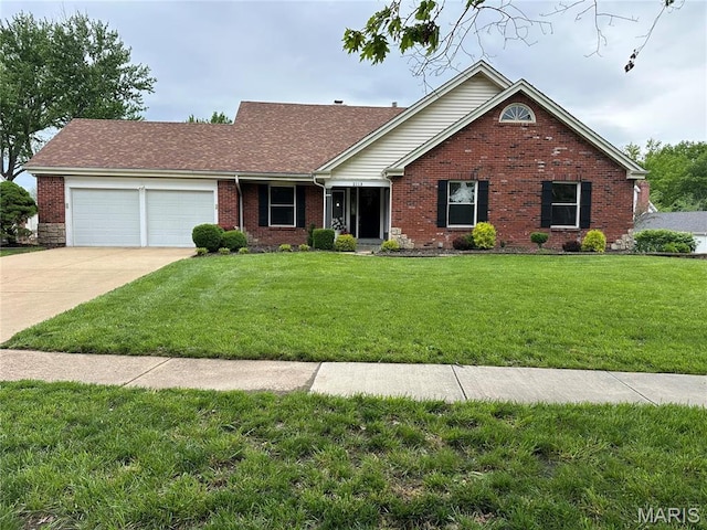 single story home featuring a garage, brick siding, a front yard, and concrete driveway
