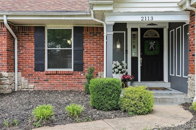2113 Fairway Bnd, Chesterfield, MO 63017 - doorway to property featuring brick siding and a shingled roof