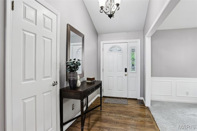 2113 Fairway Bnd, Chesterfield, MO 63017 - entrance foyer with a chandelier, dark wood-style floors, and a wainscoted wall