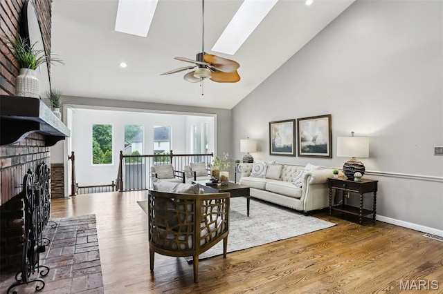 2113 Fairway Bnd, Chesterfield, MO 63017 - living area with a skylight, high vaulted ceiling, a ceiling fan, wood finished floors, and recessed lighting