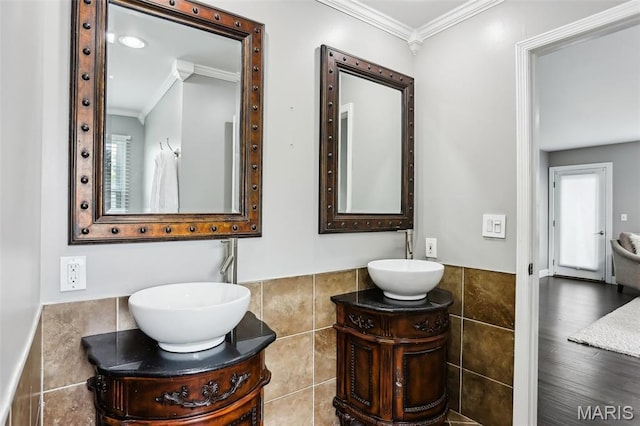 2113 Fairway Bnd, Chesterfield, MO 63017 - bathroom with tile walls, ornamental molding, vanity, and a wainscoted wall