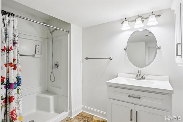 2113 Fairway Bnd, Chesterfield, MO 63017 - bathroom featuring a shower stall, baseboards, and vanity