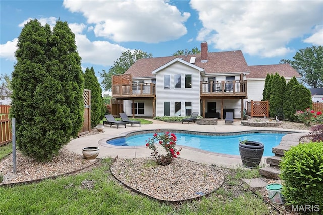 2113 Fairway Bnd, Chesterfield, MO 63017 - rear view of house with fence, a chimney, a patio, and an outdoor fire pit