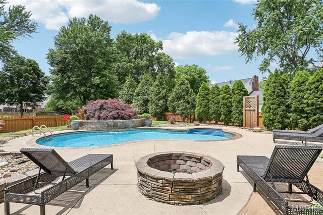 2113 Fairway Bnd, Chesterfield, MO 63017 - view of swimming pool featuring an outdoor fire pit, a patio area, and a fenced backyard