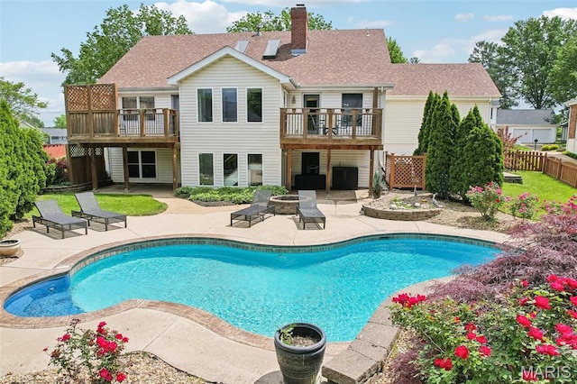 2113 Fairway Bnd, Chesterfield, MO 63017 - view of pool featuring a fire pit, a patio area, fence, and central AC unit