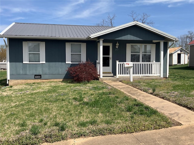 202 N Grant, Desloge, MO 63601 - bungalow with covered porch, crawl space, metal roof, a front yard, and a storage unit