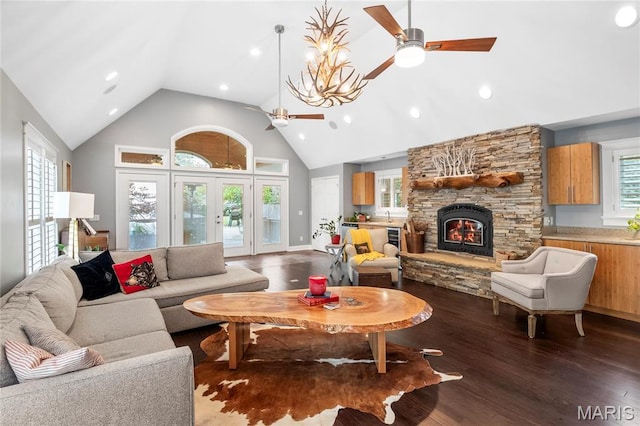 2521 High School Dr, Saint Louis, MO 63144 - living room with ceiling fan, a stone fireplace, dark wood finished floors, high vaulted ceiling, and recessed lighting