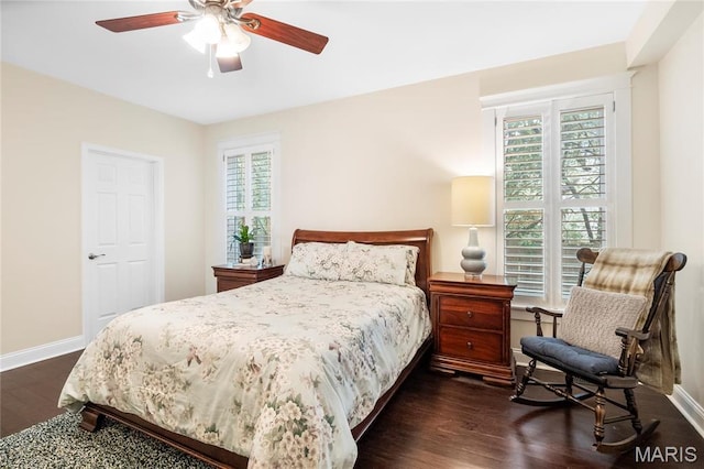 2521 High School Dr, Saint Louis, MO 63144 - bedroom featuring dark wood finished floors, baseboards, and multiple windows