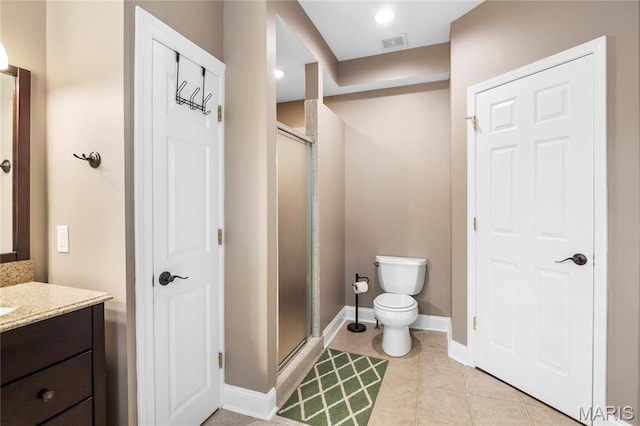 2521 High School Dr, Saint Louis, MO 63144 - full bath featuring a shower stall, vanity, baseboards, toilet, and tile patterned floors