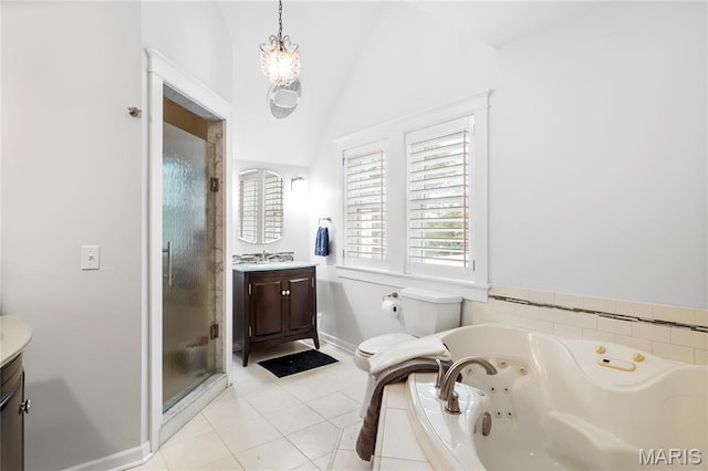 2521 High School Dr, Saint Louis, MO 63144 - full bath featuring vanity, a stall shower, vaulted ceiling, a whirlpool tub, and tile patterned flooring