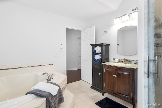2521 High School Dr, Saint Louis, MO 63144 - bathroom with vanity, a bath, and tile patterned flooring