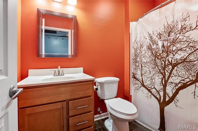 2521 High School Dr, Saint Louis, MO 63144 - bathroom featuring vanity, toilet, and tile patterned flooring