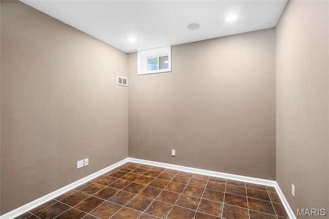 2521 High School Dr, Saint Louis, MO 63144 - basement featuring baseboards, recessed lighting, and dark tile patterned flooring