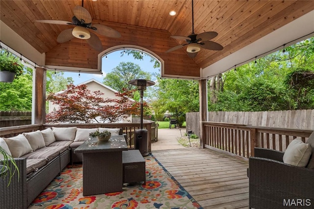2521 High School Dr, Saint Louis, MO 63144 - wooden deck with a ceiling fan, a fenced backyard, and an outdoor hangout area