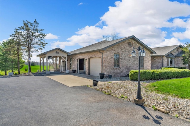 8620 State Route 163, Belleville, IL 62223 - view of front of house with a garage, brick siding, asphalt driveway, and a shingled roof