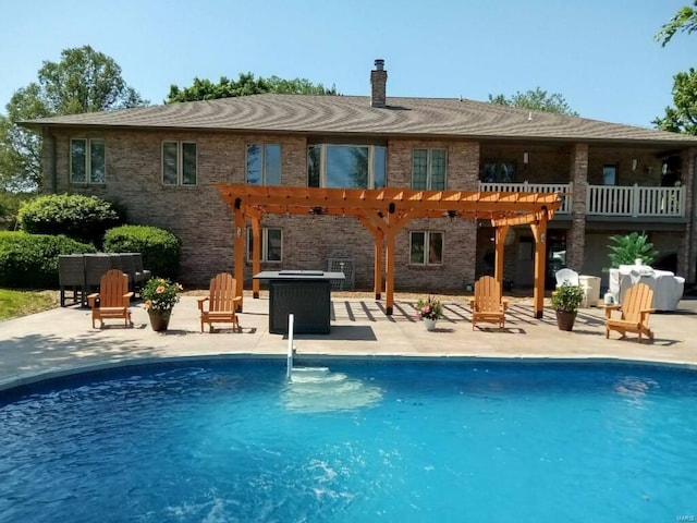 8620 State Route 163, Belleville, IL 62223 - rear view of house featuring a pergola, a patio, an outdoor pool, and brick siding