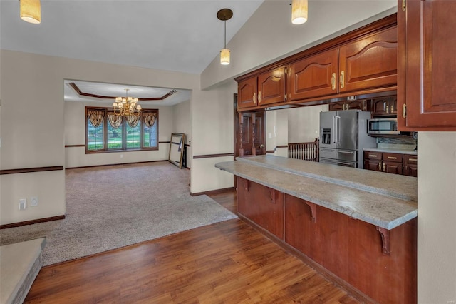8620 State Route 163, Belleville, IL 62223 - kitchen featuring stainless steel appliances, a chandelier, a breakfast bar, hanging light fixtures, and dark wood finished floors