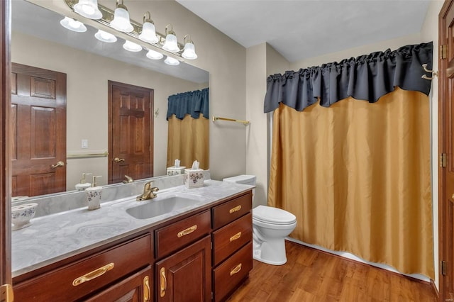 8620 State Route 163, Belleville, IL 62223 - full bathroom featuring wood finished floors, toilet, vanity, and a shower with curtain