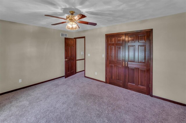 8620 State Route 163, Belleville, IL 62223 - unfurnished bedroom with carpet, baseboards, a closet, and ceiling fan