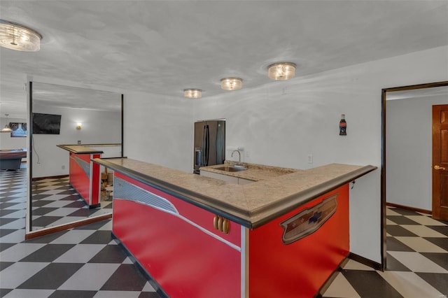 8620 State Route 163, Belleville, IL 62223 - kitchen with tile patterned floors, a sink, black fridge, and baseboards
