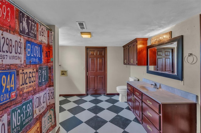 8620 State Route 163, Belleville, IL 62223 - full bathroom featuring tile patterned floors, toilet, baseboards, and vanity