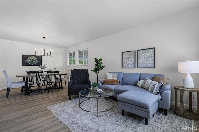 35 Florissant Park Dr, Florissant, MO 63031 - living area with a chandelier, wood finished floors, and baseboards