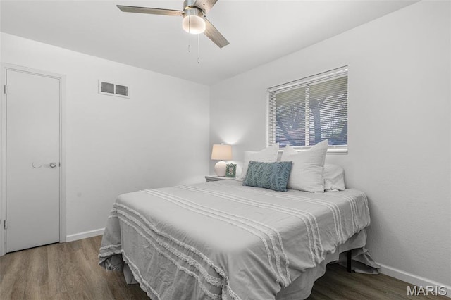 35 Florissant Park Dr, Florissant, MO 63031 - bedroom with wood finished floors, baseboards, and a ceiling fan
