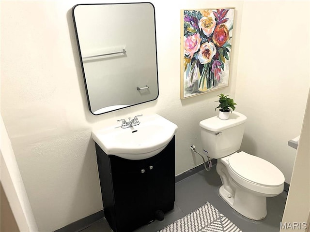 35 Florissant Park Dr, Florissant, MO 63031 - bathroom featuring vanity, toilet, and baseboards