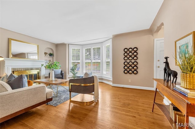 1010 Briarton Dr, Saint Louis, MO 63126 - living area featuring wood finished floors and a brick fireplace