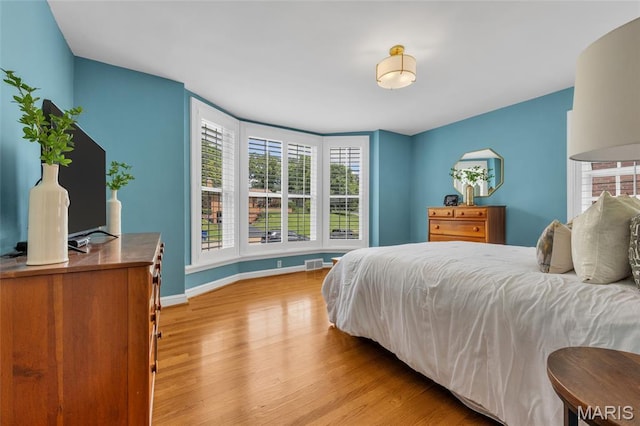 1010 Briarton Dr, Saint Louis, MO 63126 - bedroom featuring wood finished floors and baseboards