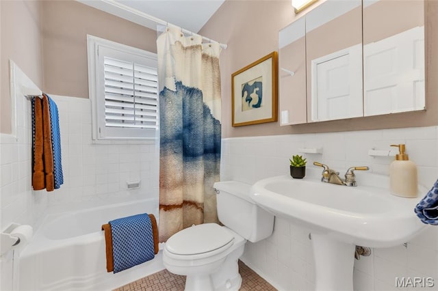 1010 Briarton Dr, Saint Louis, MO 63126 - bathroom featuring tile walls, a tub, tile patterned floors, a shower with shower curtain, and a wainscoted wall
