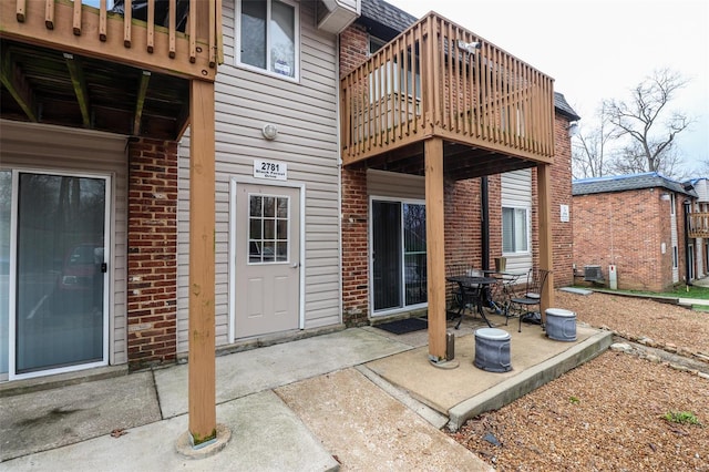 2781 Blackforest Dr Unit C, Saint Louis, MO 63129 - back of house with brick siding, a patio, and a balcony