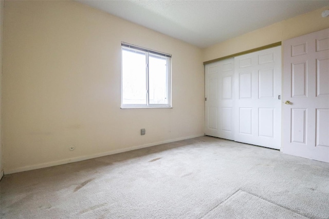 2781 Blackforest Dr Unit C, Saint Louis, MO 63129 - unfurnished bedroom with carpet floors, baseboards, and a closet