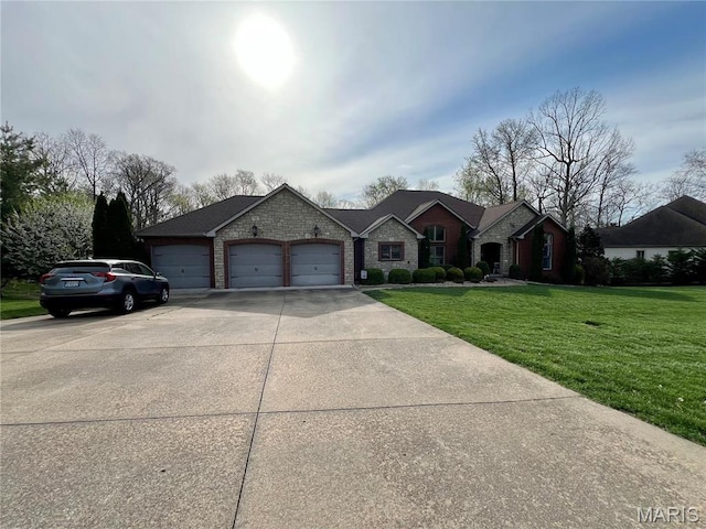 view of front of home with an attached garage, a front yard, concrete driveway, and stone siding