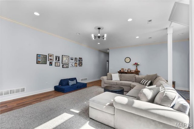 living area with crown molding, wood finished floors, recessed lighting, baseboards, and a chandelier
