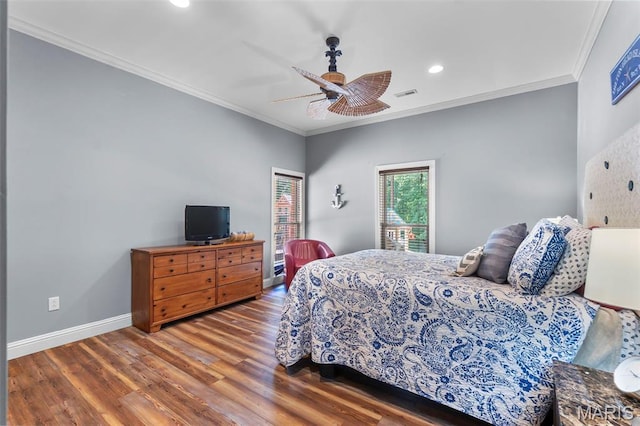 bedroom featuring wood finished floors, crown molding, baseboards, recessed lighting, and ceiling fan