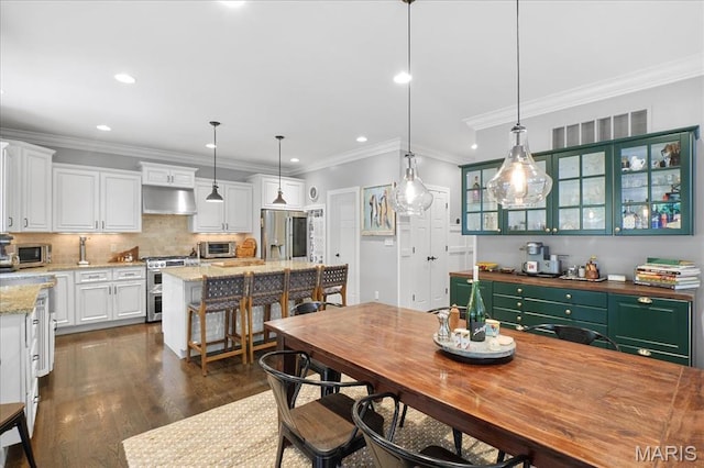 17 Denver Pl, Saint Louis, MO 63119 - dining area with recessed lighting, dark wood-type flooring, and crown molding