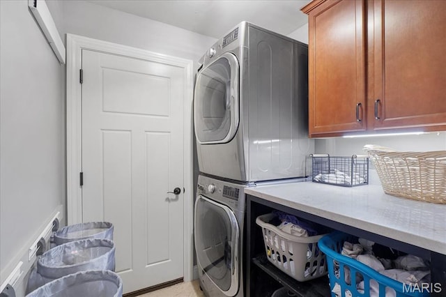 17 Denver Pl, Saint Louis, MO 63119 - washroom with cabinet space and stacked washing machine and dryer
