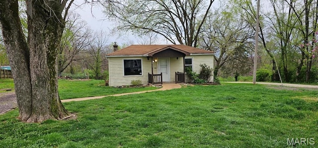 12753 Hencher Rd, De Soto, MO 63020 - view of front of house with a chimney and a front lawn