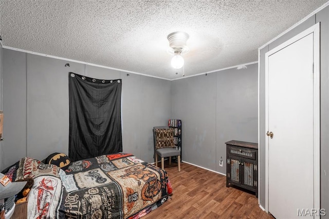 19518 State Highway Ww, Puxico, MO 63960 - bedroom with crown molding, wood finished floors, and a textured ceiling