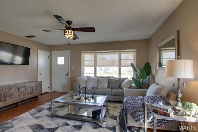 902 E Morgan St, Edina, MO 63537 - living area with plenty of natural light, ceiling fan, and wood finished floors