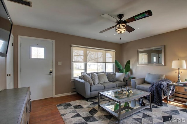 902 E Morgan St, Edina, MO 63537 - living room with a ceiling fan, wood finished floors, and baseboards