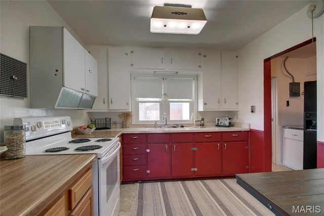 902 E Morgan St, Edina, MO 63537 - kitchen with electric range, red cabinets, a sink, and light countertops