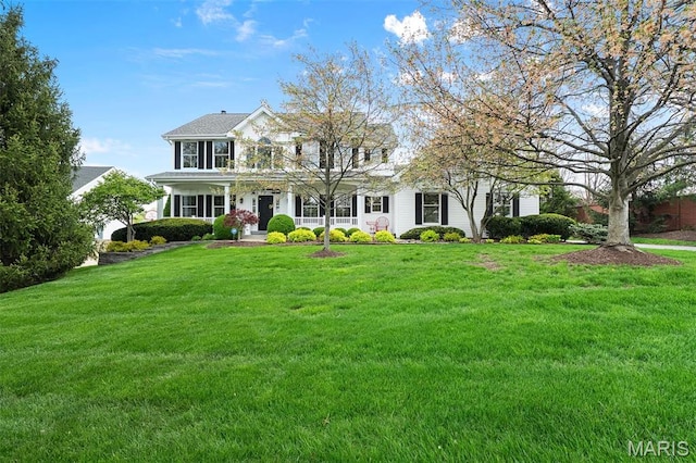 1114 Lockett Rd, Des Peres, MO 63131 - colonial house featuring a porch and a front yard