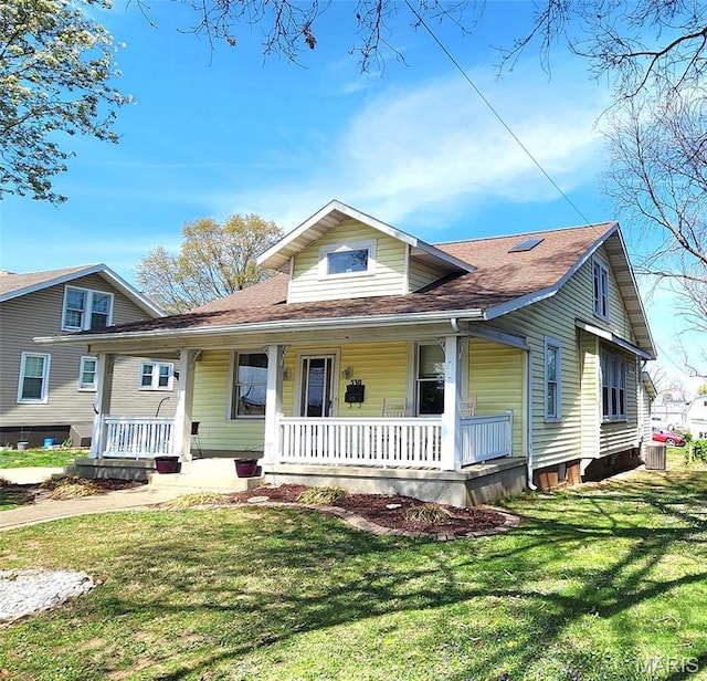 530 W Holmes, Chester, IL 62233 - view of front of property featuring covered porch, central AC unit, a front lawn, and a shingled roof