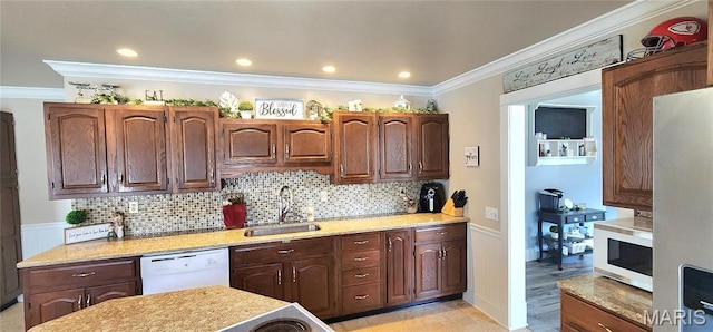 530 W Holmes, Chester, IL 62233 - kitchen featuring white appliances, a sink, crown molding, backsplash, and a wainscoted wall
