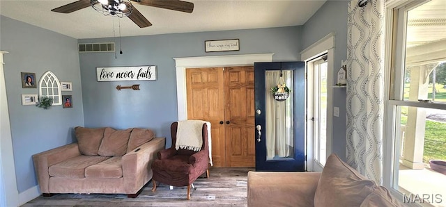 530 W Holmes, Chester, IL 62233 - sitting room with wood finished floors, plenty of natural light, and a ceiling fan