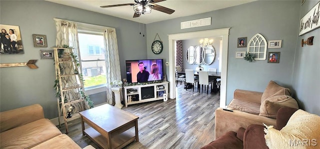 530 W Holmes, Chester, IL 62233 - living area featuring a ceiling fan, wood finished floors, and a chandelier