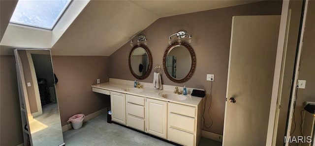 530 W Holmes, Chester, IL 62233 - bathroom with lofted ceiling, a skylight, and double vanity